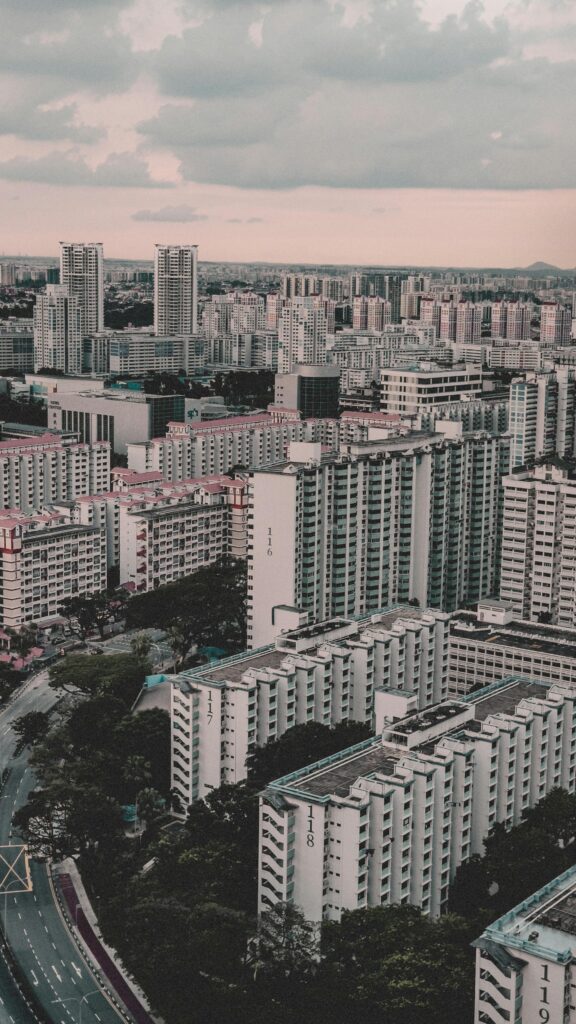 Aerial view of Singapore HDB flats in a dense urban neighborhood under cloudy sky